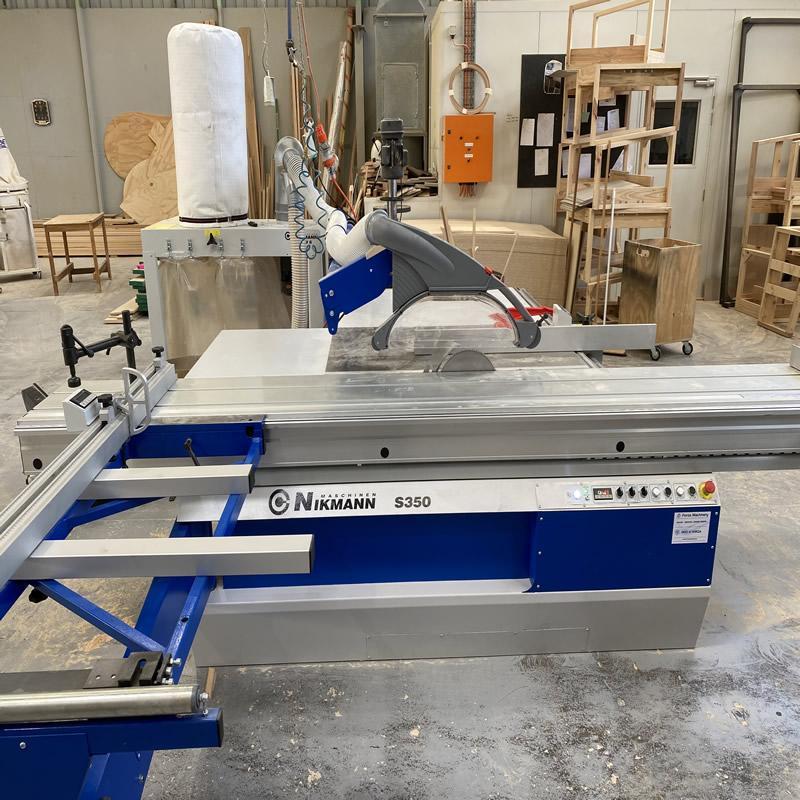 Panel saw cutting sheet material